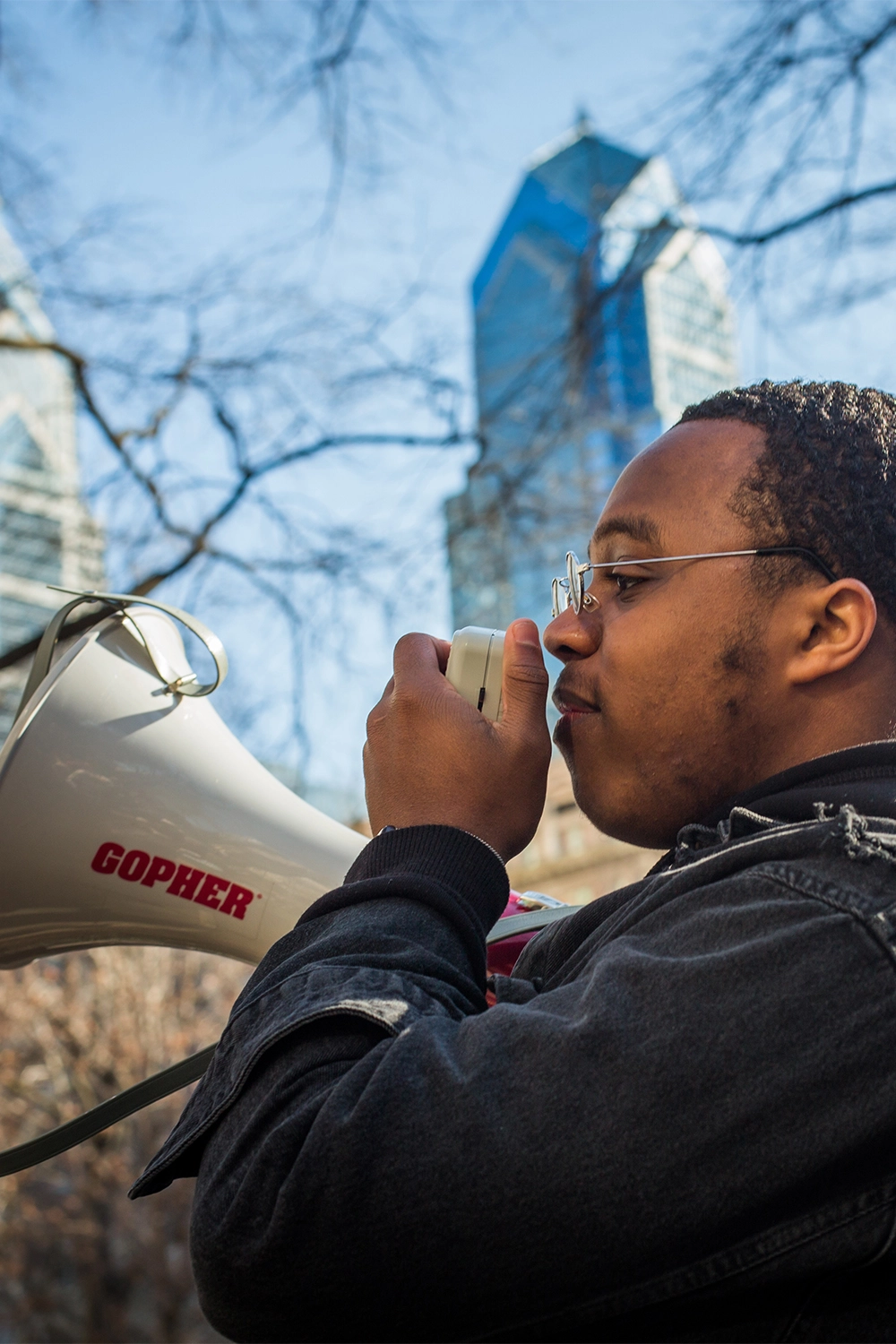Freire High student with a megaphone at an outdoor event