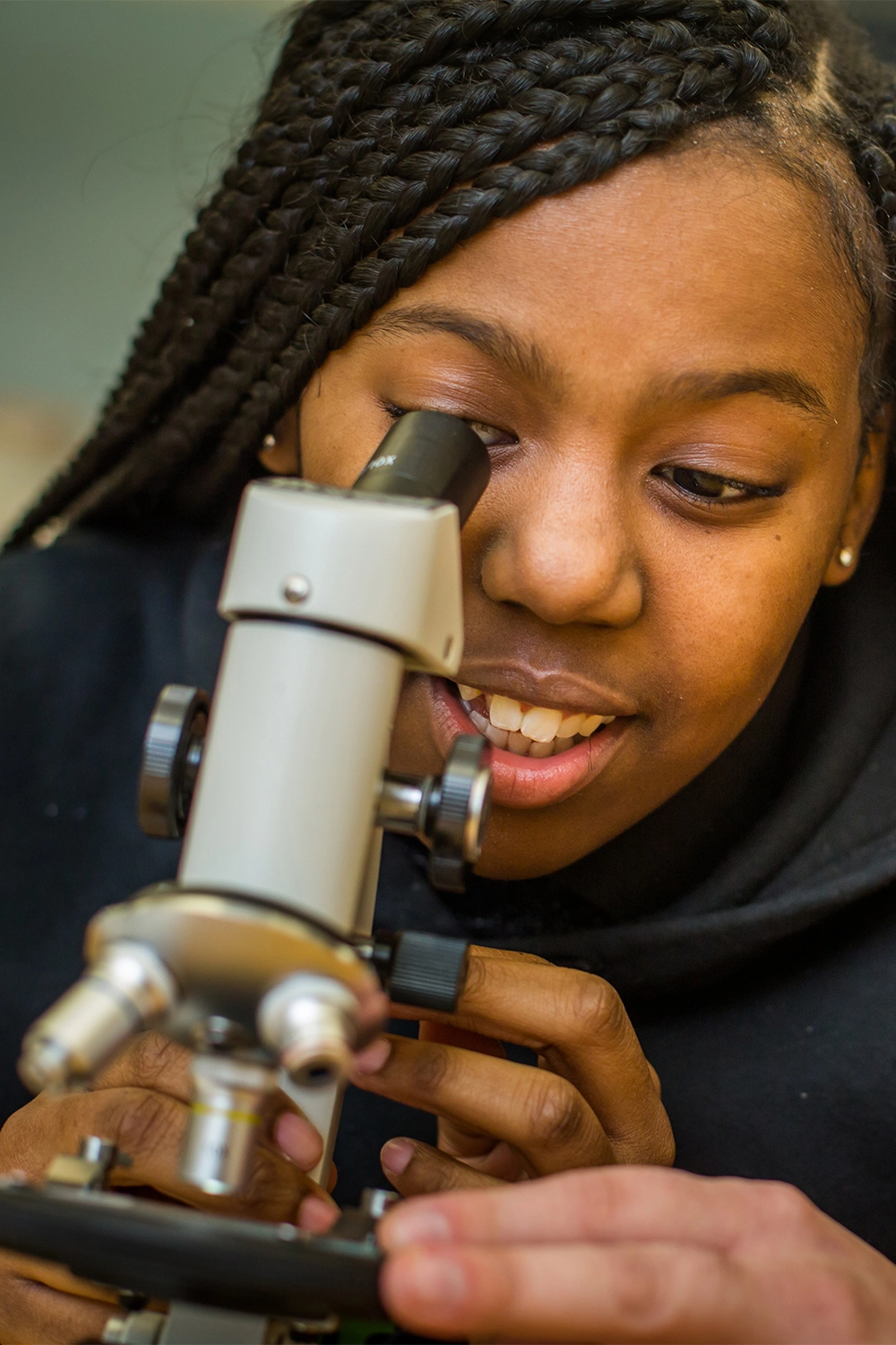 Freire Middle student using a microscope