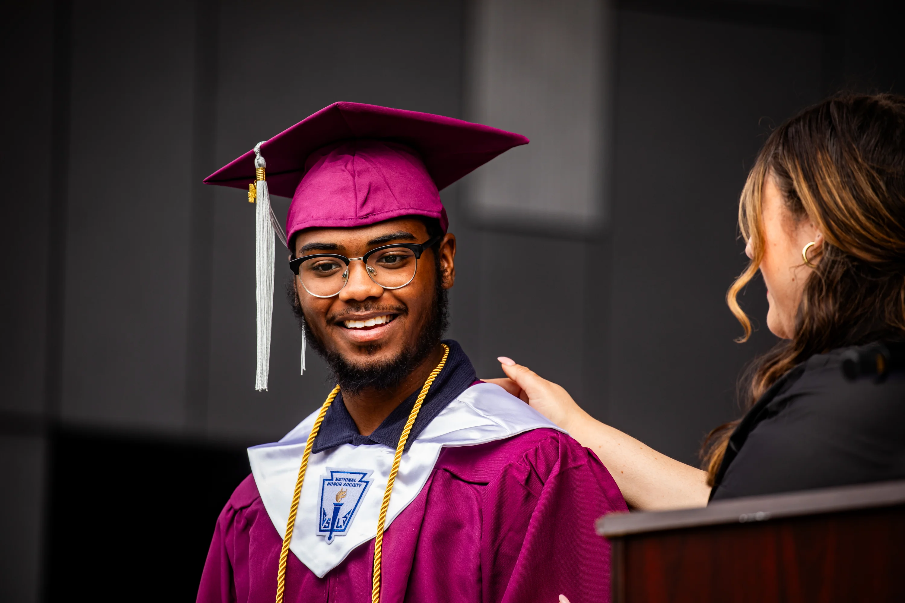TECH Freire graduate holding his diploma