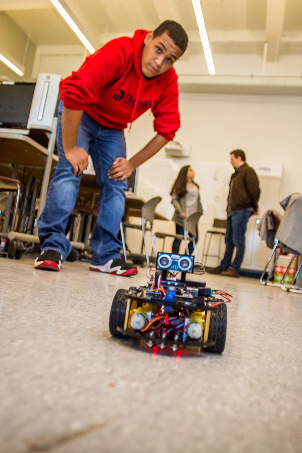 TECH Freire student building a robot